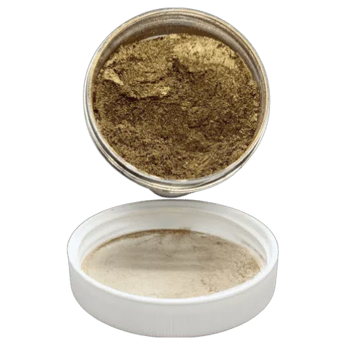 bronzer pearl in jar spilling onto the lid in front of it