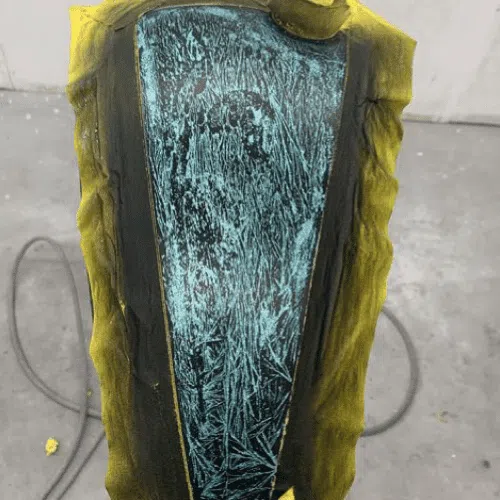 crystal mess over teal flake on a motorcycle gas tank