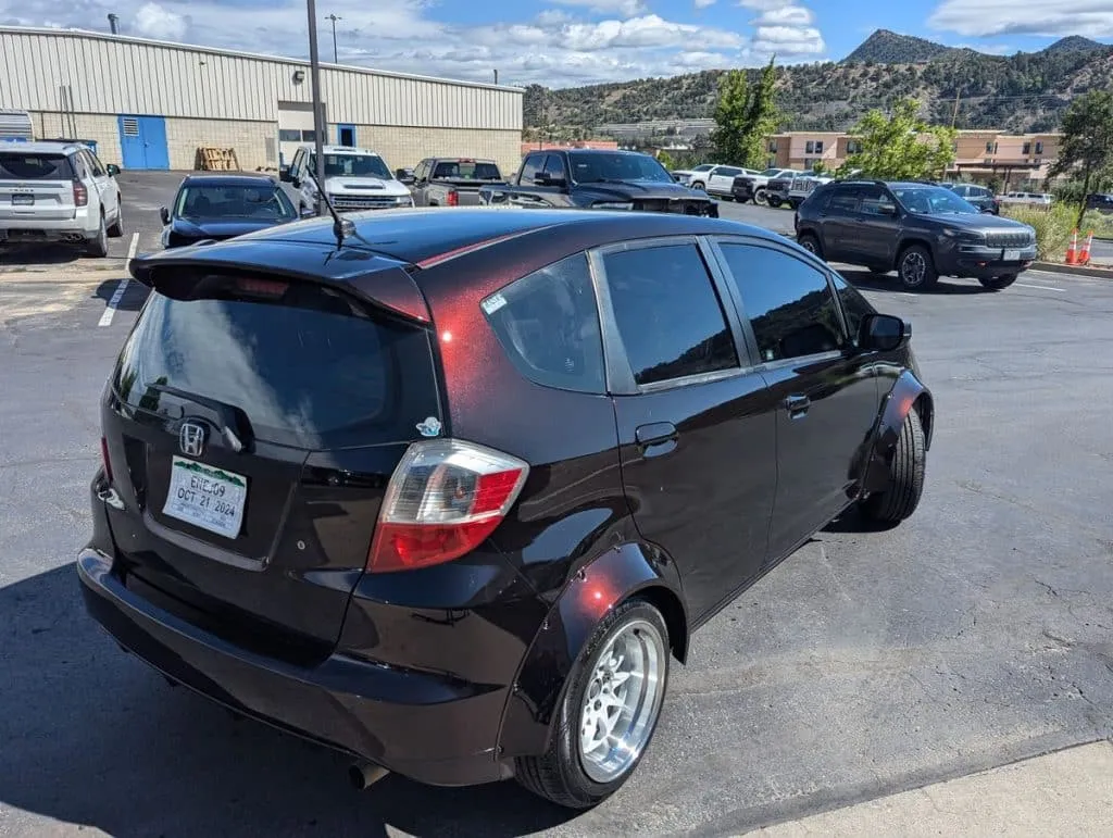 Honda Fit Hood in 666 Demon's Blood over Black passenger side rear view in sun