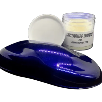 lactarius indigo chameleon pearl spray out over black and jar of pearl powder