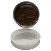 mocha pearl in jar spilling onto white lid underneath it