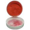 peach gold pearl powder in jar spilling onto lid