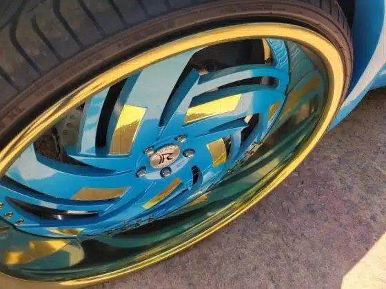 two-tone gold rims made with Pineapple Urethane Cande and Bondi Beach pearl coat on a Rucci wheel