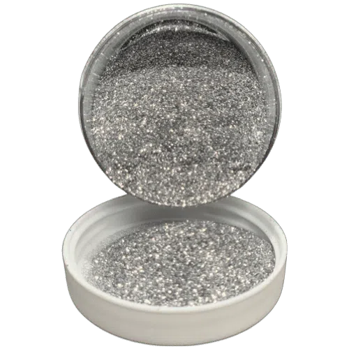 .008" sirius silver metal flake in jar spilling onto the lid in front of it