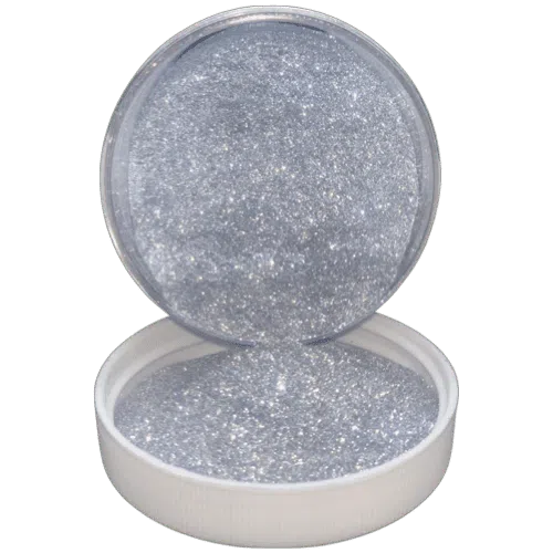 smashed meth pipe flake in jar spilling onto the lid in front of it