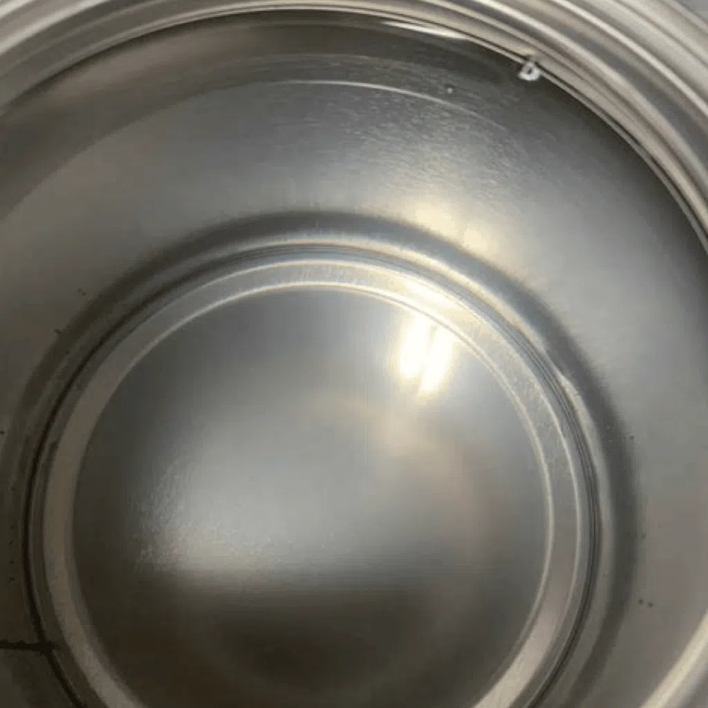 Triple C Intercoat Clear in a quart can showing it's clarity